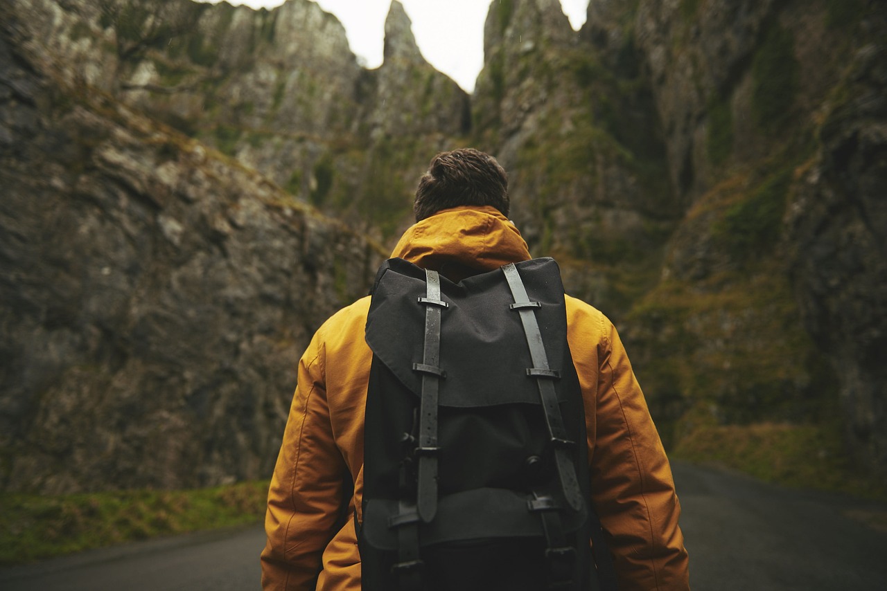 create image A person hiking through a scenic mountain landscape.